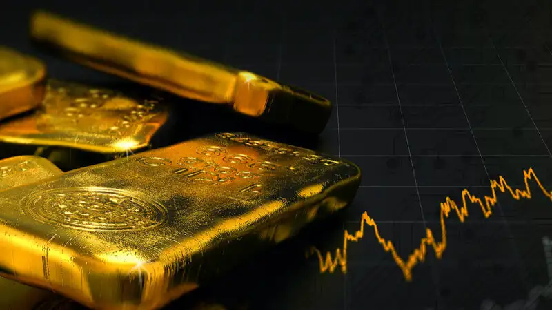 How can a beginner invest in gold?